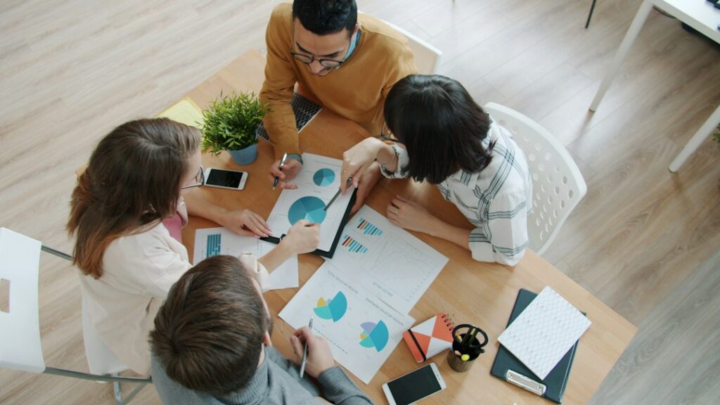 Team reviewing training documents at a meeting table